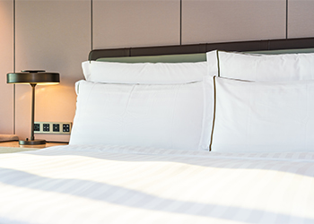 White,Comfortable,Pillow,And,Blanket,On,Bed,Decoration,In,Bedroom Protect your hair while sleeping