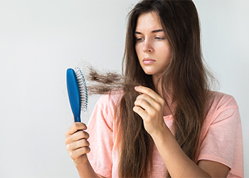 Young,Woman,Is,Very,Upset,Because,Of,Hair,Loss Can tangles cause hair loss?